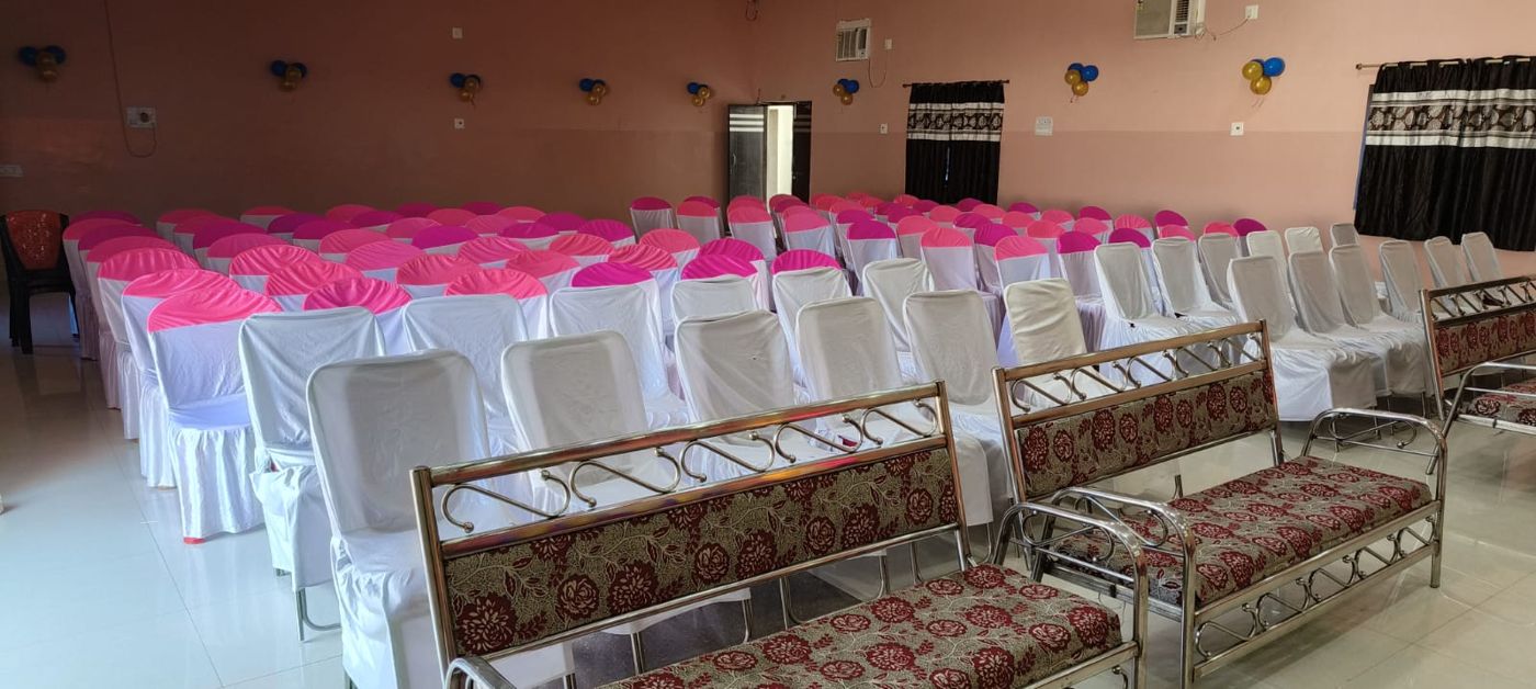 Indoor banquet hall seating at Vasundhara Garden