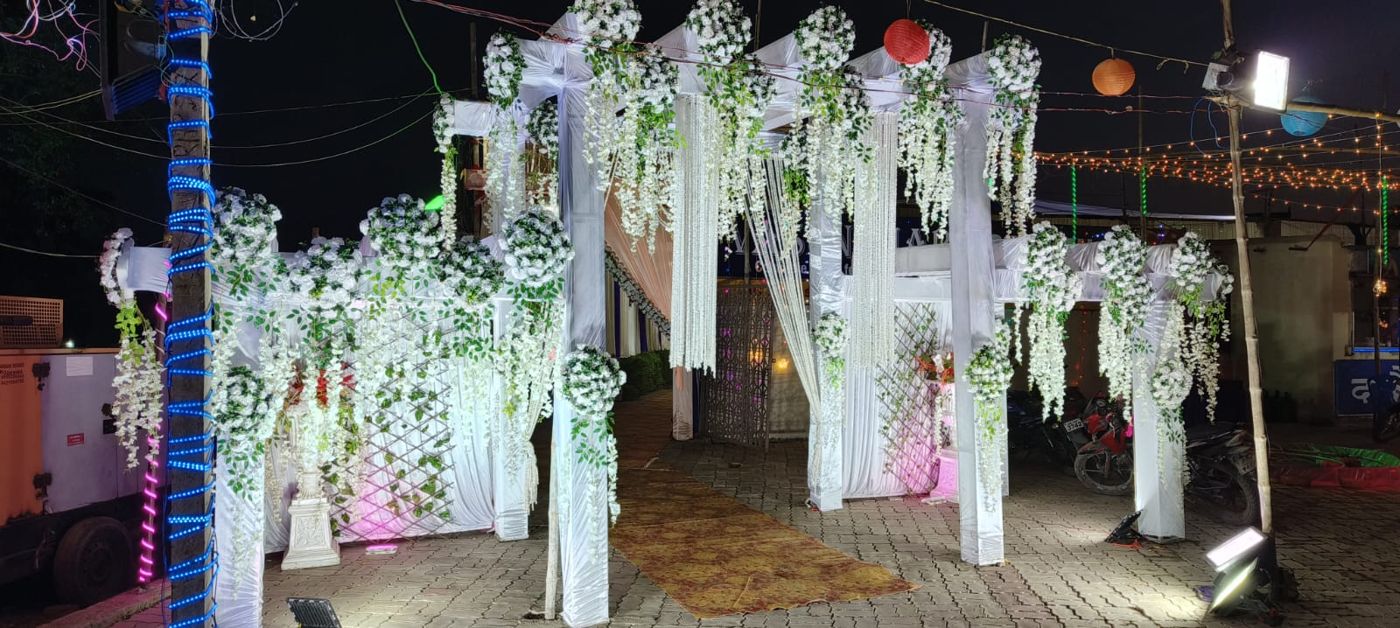 Vasundhara Garden — White floral entry decoration